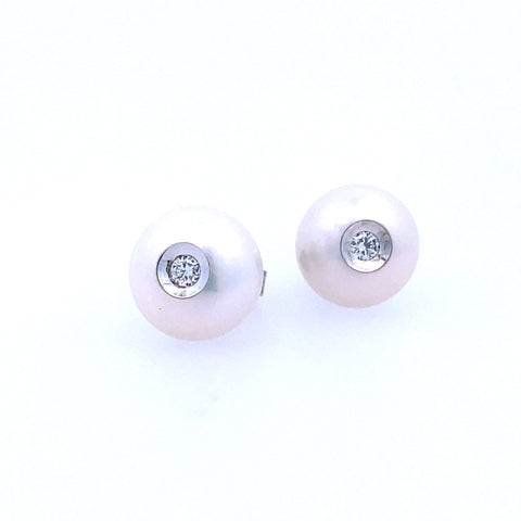Lady's White 14 Karat Bezel Set, Earrings With 2=0.08Tw Round Diamonds
