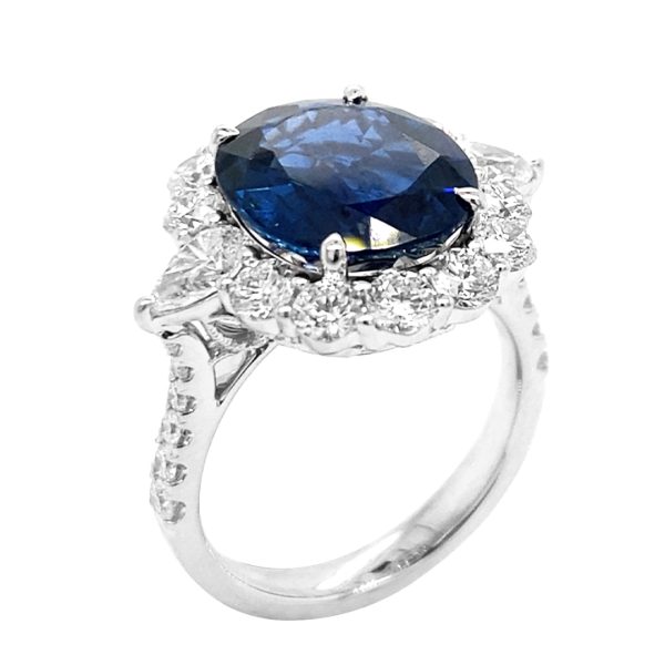 A sapphire and diamond halo ring