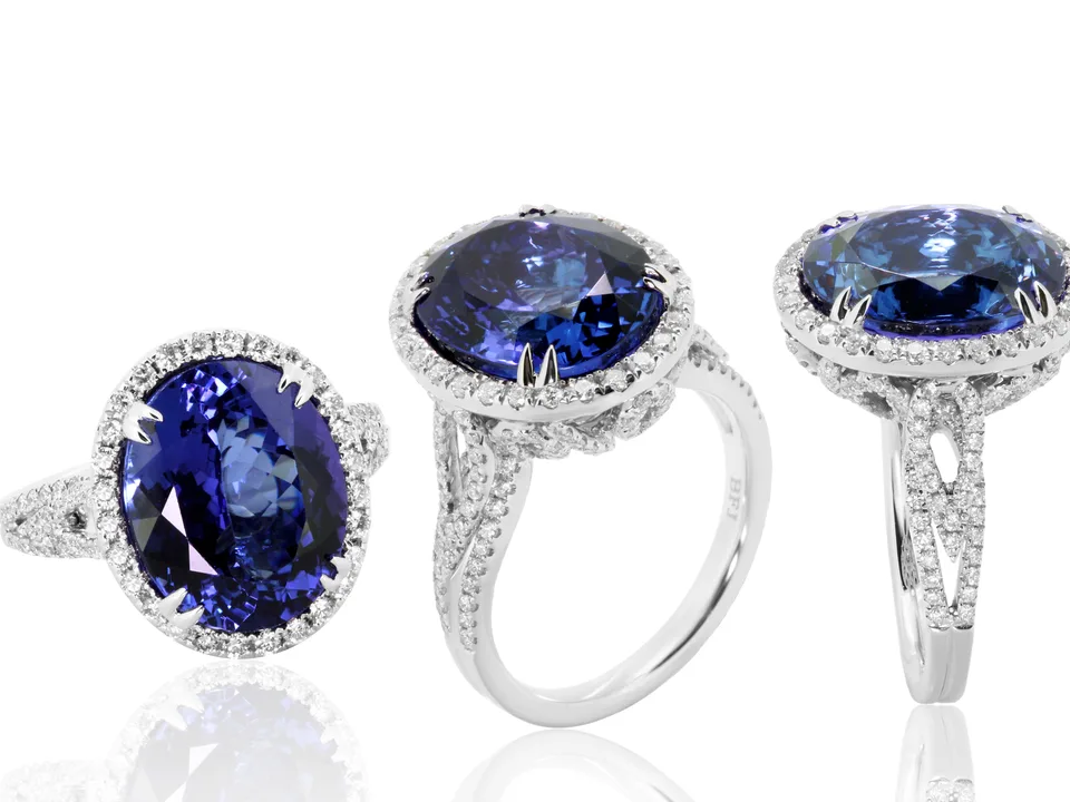 A finished sapphire ring, shown from three sides