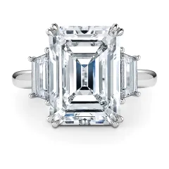 An emerald-cut diamond three-stone ring in platinum, from The J. David Legacy Collection