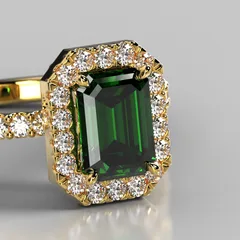 An emerald ring in yellow gold, framed in diamonds