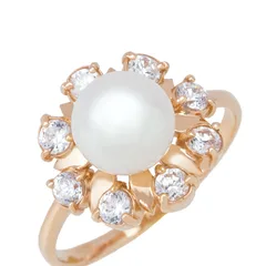 A pearl ring in rose gold, circled with diamonds