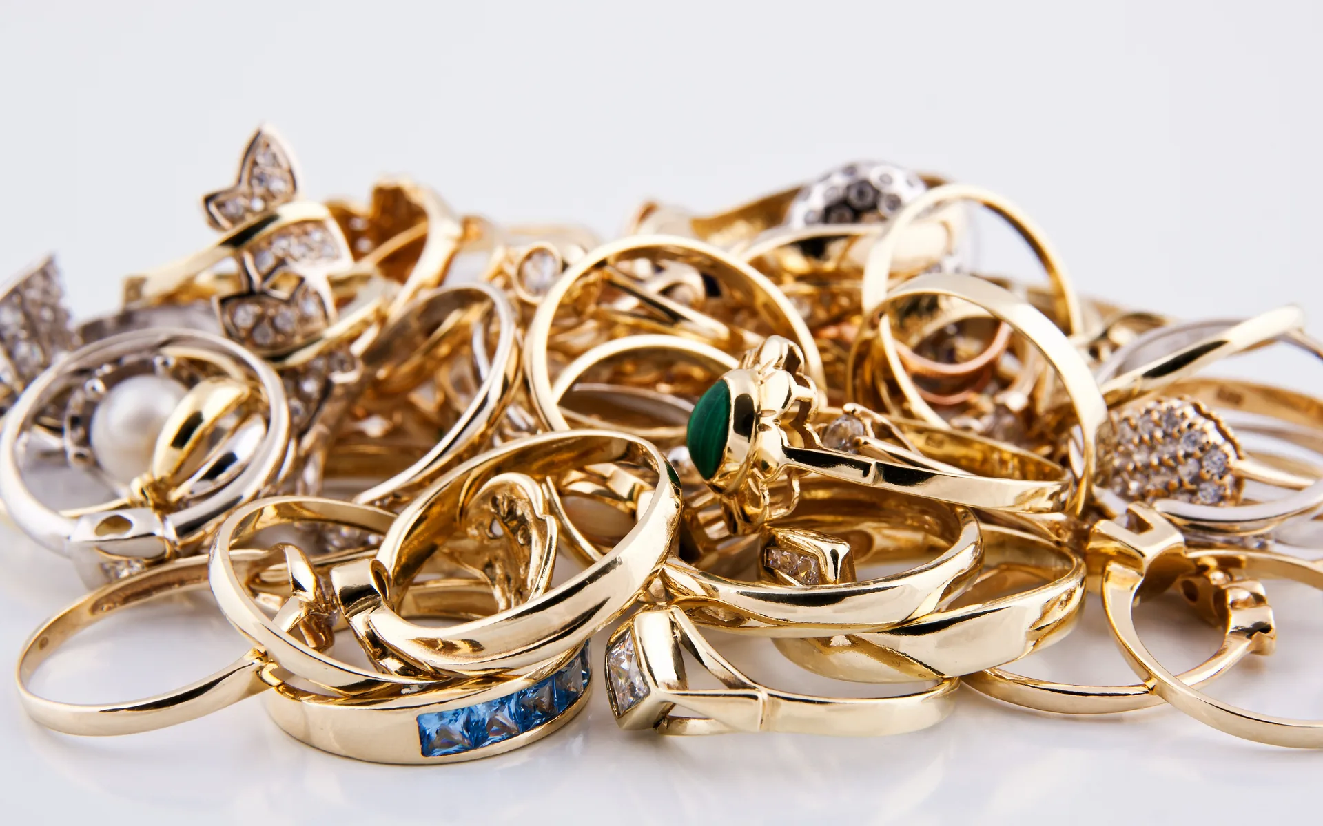 Gold rings and bands in yellow and white gold gathered together