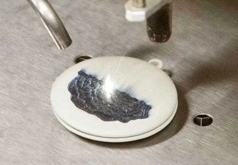 Engraving detail on a silver pendant