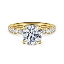 Yellow 14 Karat Prong Set Ring one 9.00mm Round Cubic Zirconium
0.35tw Round G/H SI2 Diamonds