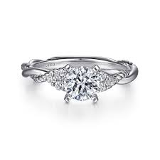 White 14 Karat Crossover With Rope Pattern Ring Size 6.5 one = 7.40mm Round Cubic Zirconium
= 0.13tw Round G/H SI1 Diamonds