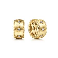 Lady's Yellow 14 Karat Bujukan Collection, Huggie Earrings With = 0.15Tw Round G/H Si2 Diamonds