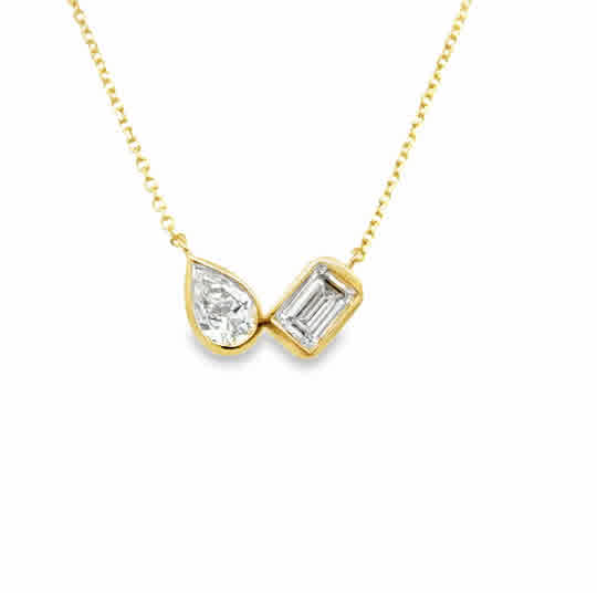 Lady's Yellow 14 Karat Two Stone, Bezel Stationary Necklace Length 18 one = 0.40ct Pear G/H SI2 Diamond
one = 0.525ct Emerald G/H SI2 Diamond