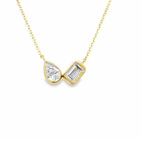 Lady's Yellow 14 Karat Two Stone, Bezel Stationary Necklace Length 18 one = 0.40ct Pear G/H SI2 Diamond
one = 0.525ct Emerald G/H SI2 Diamond