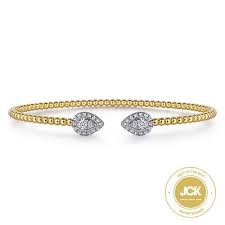 White/Yellow 14 Karat Bujukan Collection, Pear Shape Halo Bangle Bracelet Length 6.25 With = 0.32Tw Round G/H Si2 Diamonds