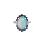 Lady's Yellow 14 Karat Oval Halo Fashion Ring With One 3.09Ct Oval Opal, 0.11Tw Round G/H Si1 Diamonds And 0.9 Twt Other Stones
