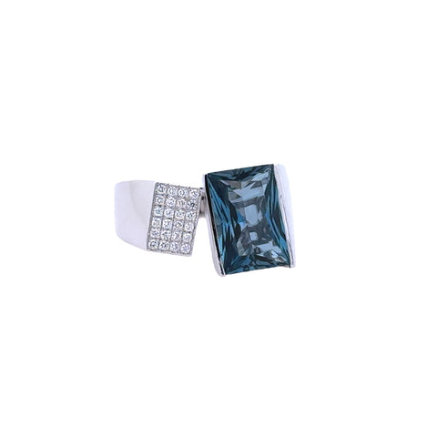 Lady's White 14 Karat Modern Fashion Ring With One 4.50Ct Emerald Blue Topaz And 0.15Tw Round G/H Si1 Diamonds