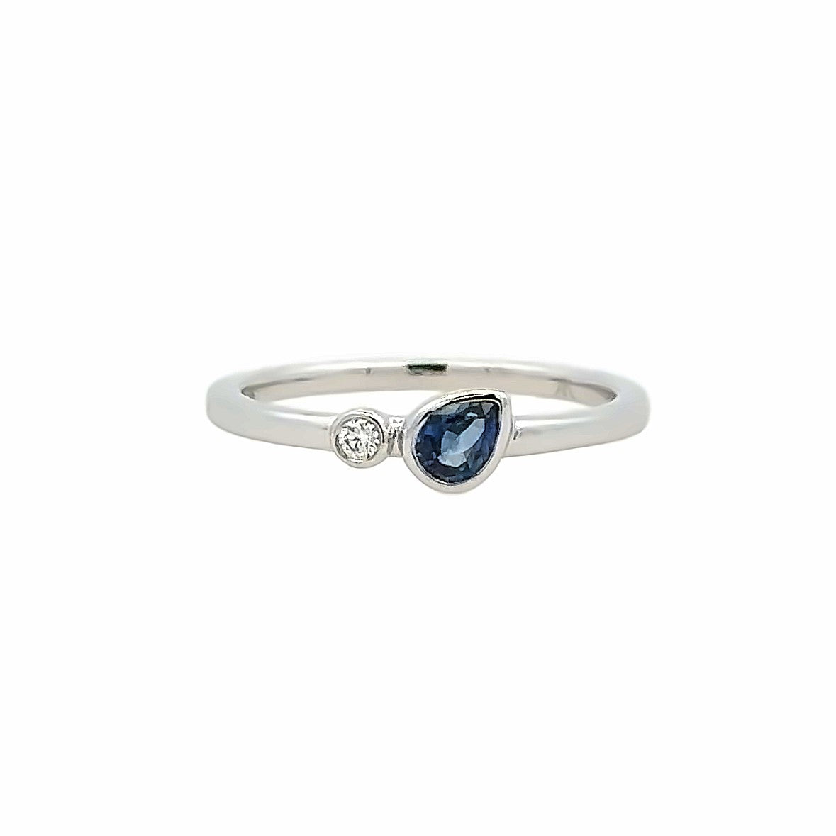 Lady's White 14 Karat Bezel Set, Stackable Fashion Ring one 0.26ct Pear Sapphire
one 0.02ct Round G/H SI1 Diamond