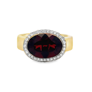 Lady's Yellow 14 Karat East To West Halo Fashion Fashion Ring Size 7 With One 5.4Ct Oval Garnet And 0.42Tw Round G/H Si1 Diamonds