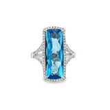 Lady's White 14 Karat Elongated Halo With Split Shank Fashion Fashion Ring Size 7 With One 9.25Ct Retangular Cushion Blue Topaz And 0.4Tw Round G/H Si1 Diamonds