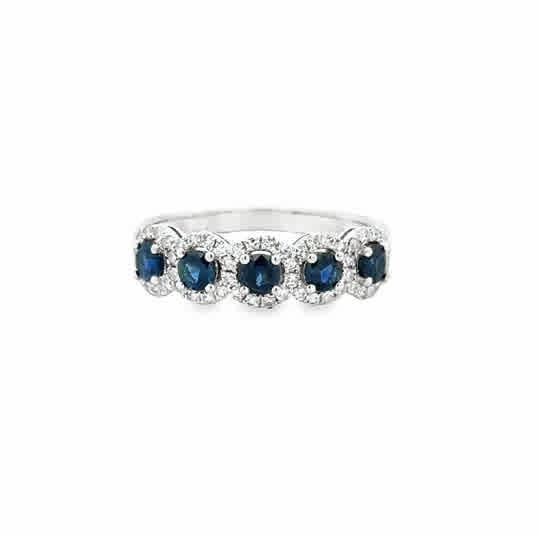 Lady's White 14 Karat Halo Stations Fashion Ring Size 7 5 = 0.71tw Round Sapphires
= 0.32tw Round G/H SI2 Single Cut Diamonds