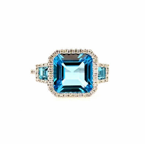 Lady's White 14 Karat Three Stone Halo Style Fashion Ring 3 = 4.40tw Various Shapes Blue Topazs
= 0.20tw Round G/H SI1 Diamonds