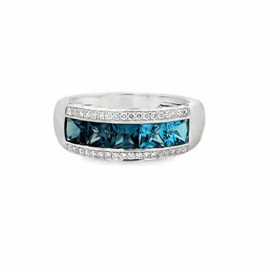 Lady's White 14 Karat Channel Set, Graduating Fashion Ring = 2.15tw Princess Blue Topazs
= 0.14tw Round G/H SI1 Diamonds