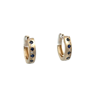 Lady's Yellow 14 Karat Satin Offset Huggie Hoops 13.5Mm Earrings With 0.24Tw Round Sapphires And 0.04Tw Round Diamonds