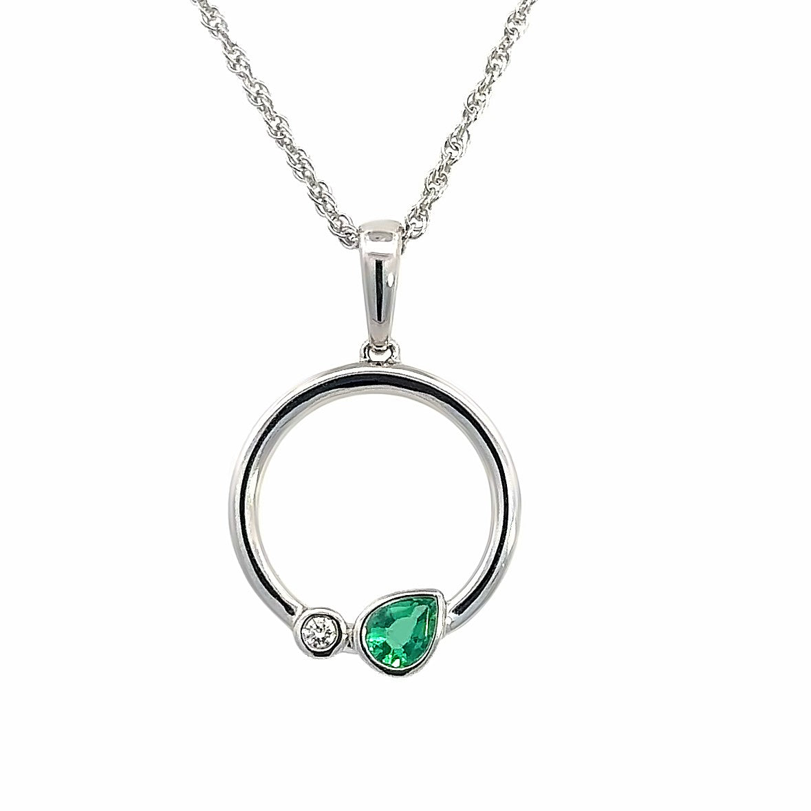 Lady's White 14 Karat Circle With Bezels Necklace With One = 0.20Ct Pear Emerald And One = 0.02Ct Round G/H Si1 Diamond