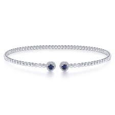Lady's White 14 Karat Bujukan Collection, Round Halo, Split Bangle Bracelet Length 6.25 With 2 = 0.25Tw Round Sapphires And = 0.11Tw Round G/H Si2 Diamonds