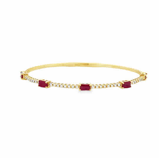 Lady's Yellow 14 Karat Flexible Bangle With Emerald Stations Bracelet Length 6.75 5 = 1.56tw Emerald Rubys
= 0.32tw Round G/H SI2 Diamonds