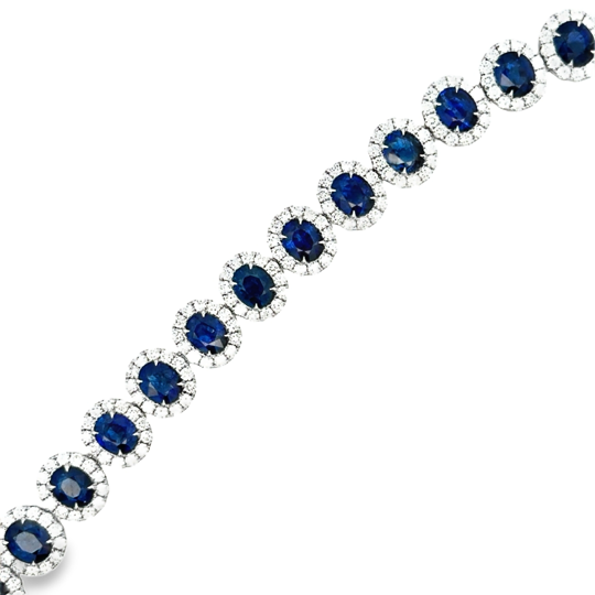 Lady's White 18 Karat Oval Halo Bracelet Length 7 23 = 14.81tw Oval Sapphires
299 = 4.67tw Round G/H SI1 Diamonds