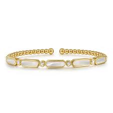 Lady's Yellow 14 Karat Bezel Stations, Bujukan Bracelet Length 6.25 With = 2.13Tw Various Shapes Mother Of Pearls And 6 = 0.20Tw Round G/H Si2 Diamonds