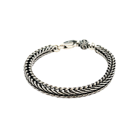 Bold, supple, fluid, snakelike, this foxtail chain bracelet  in sterling silver is in a league of its own. Beautifully oxidized and hand polished, this complex pattern flows around the wrist and draws the eye closer. There are a great many foxtail pattern