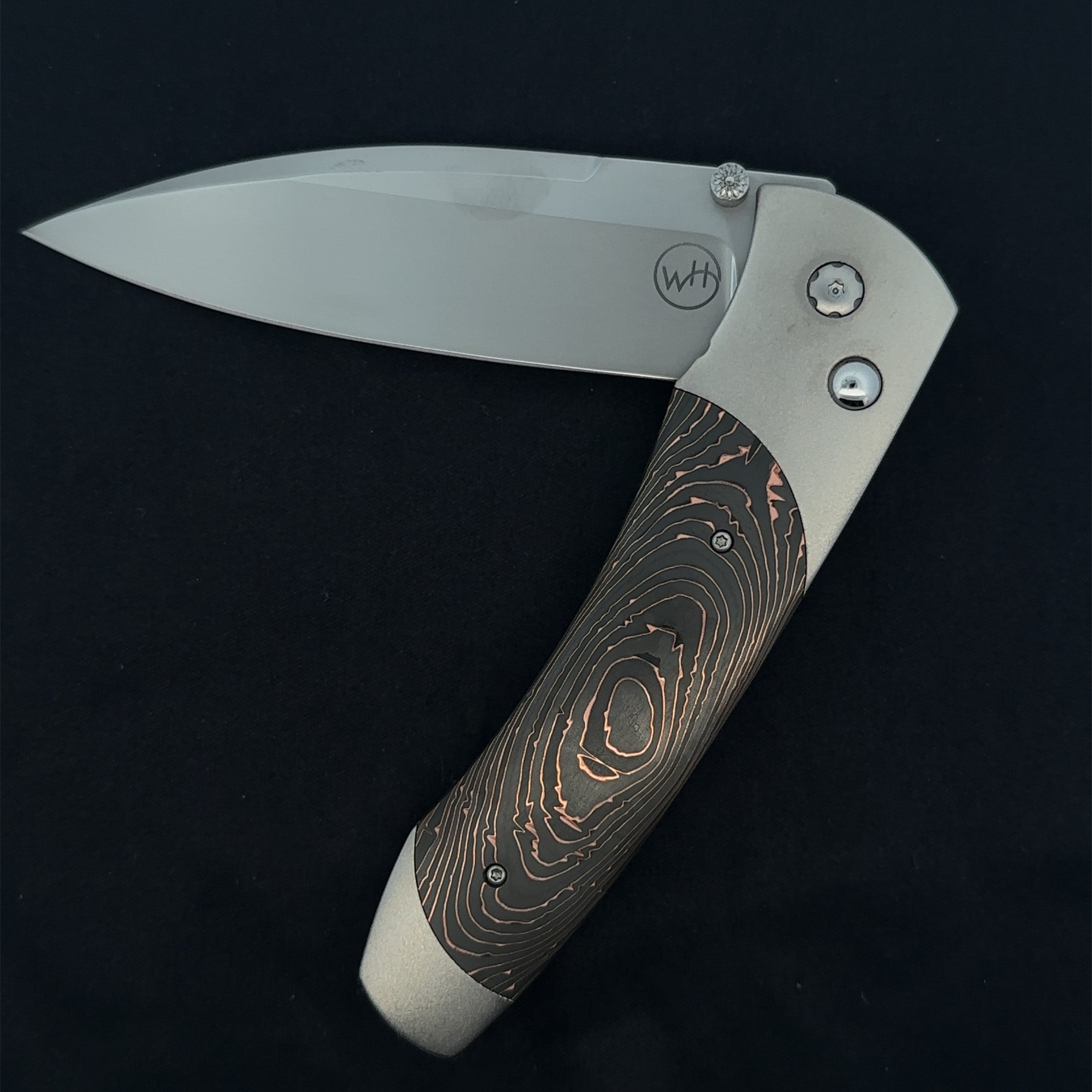 William Henry "A300-6" Knife with S35VN Stainless Steel Blade and Hand Finished Aerospace Grade Titanium Frame with Inlaid 'Copper Swirl' Carbon Fiber.