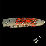 The Spearpoint ‘Laguna’ William Henry Knife with Aerospace Grade Titanium and Apple Coral Inlaid Frame, with 'Copper Wave' Damascus Steel Blade with VG-5 Core.