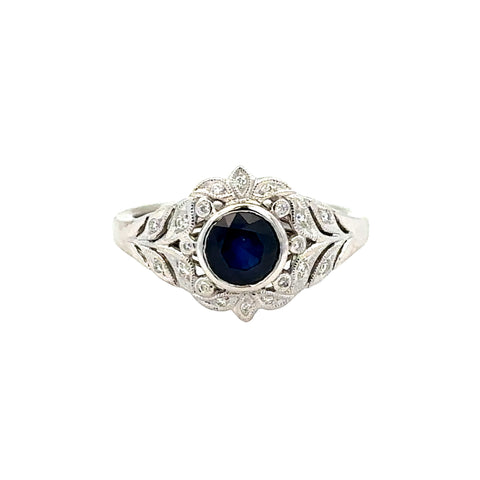 Lady's White 14 Karat Vintage Bezel Fashion Fashion Ring Size 6.5 With One 0.98Ct Round Sapphire And 0.08Tw Round G/H Si1 Diamonds
