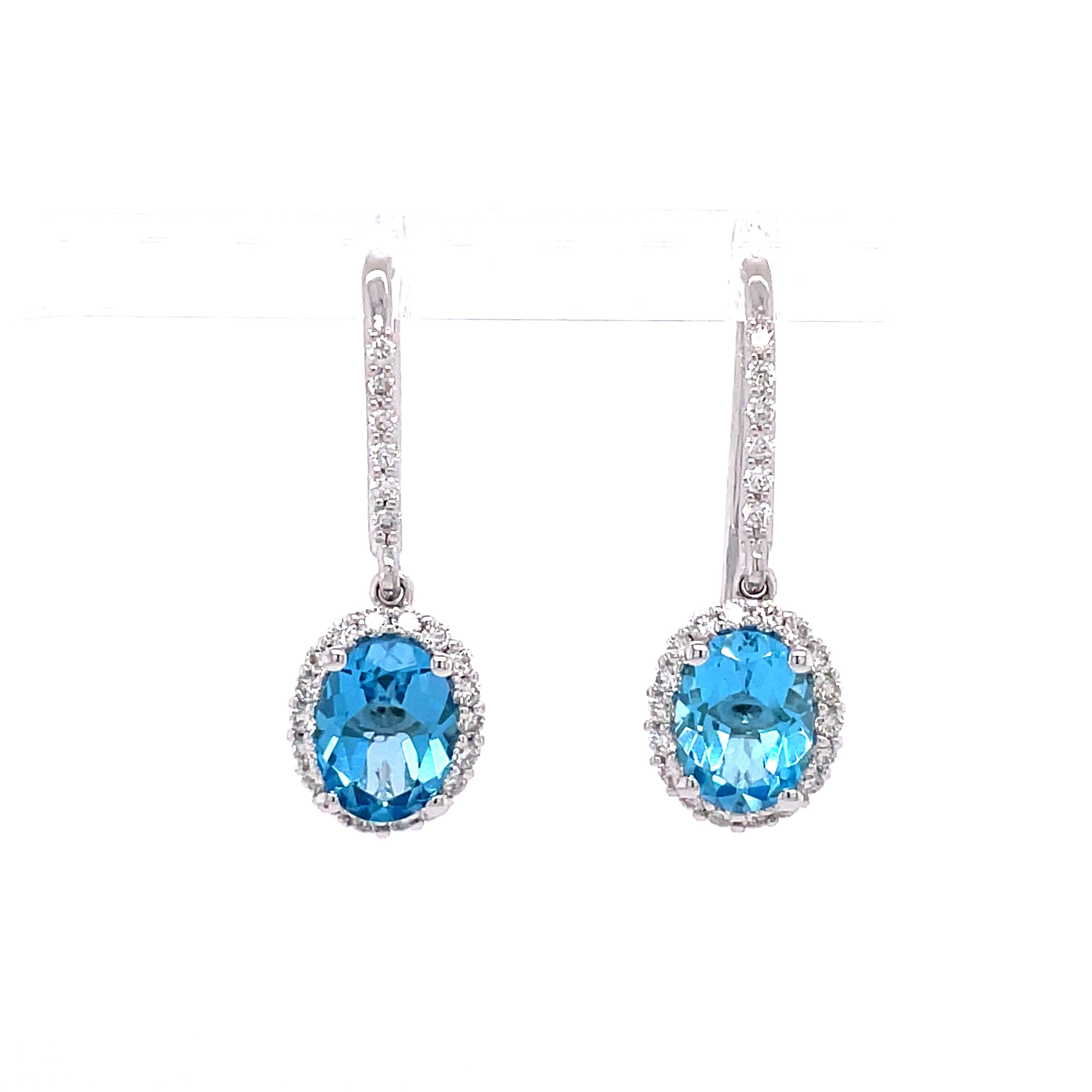 Lady's White 14 Karat Oval Dangle Fashion Earrings Earrings With 2=2.90Tw Oval Blue Topazs And 0.50Tw Round H/I Si2 Diamonds