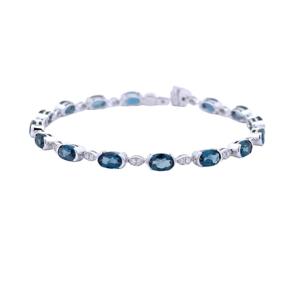 Lady's White 14 Karat Oval, Half Bezel Link Bracelet With 15=7.20Tw Oval Blue Topazs And 0.16Tw Round G/H Si1 Diamonds