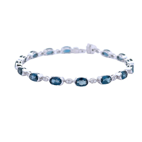 Lady's White 14 Karat Oval, Half Bezel Link Bracelet With 15=7.20Tw Oval Blue Topazs And 0.16Tw Round G/H Si1 Diamonds
