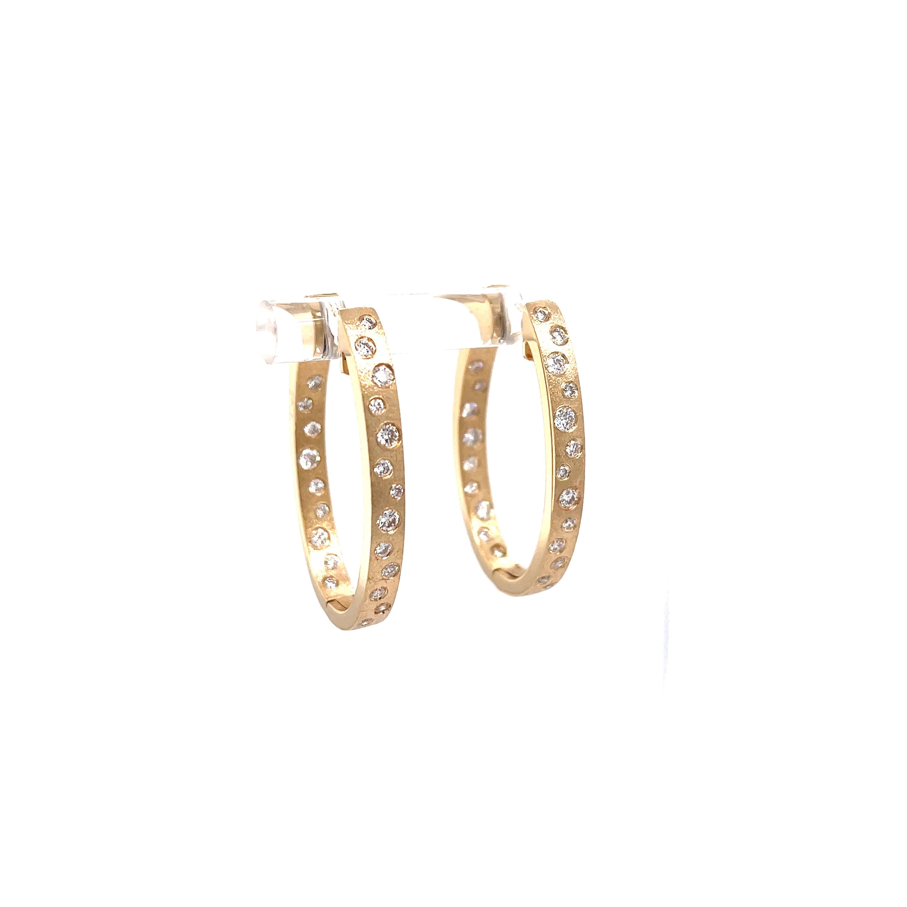 Lady's Yellow Satin 14 Karat Oval Hoops With Flush Set Earrings With 0.63Tw Round G/H Si1 Diamonds