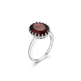 Lady's White Sterling Silver Oval Fashion Ring With One = Oval Garnet