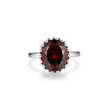 Lady's White Sterling Silver Oval Fashion Ring With One = Oval Garnet