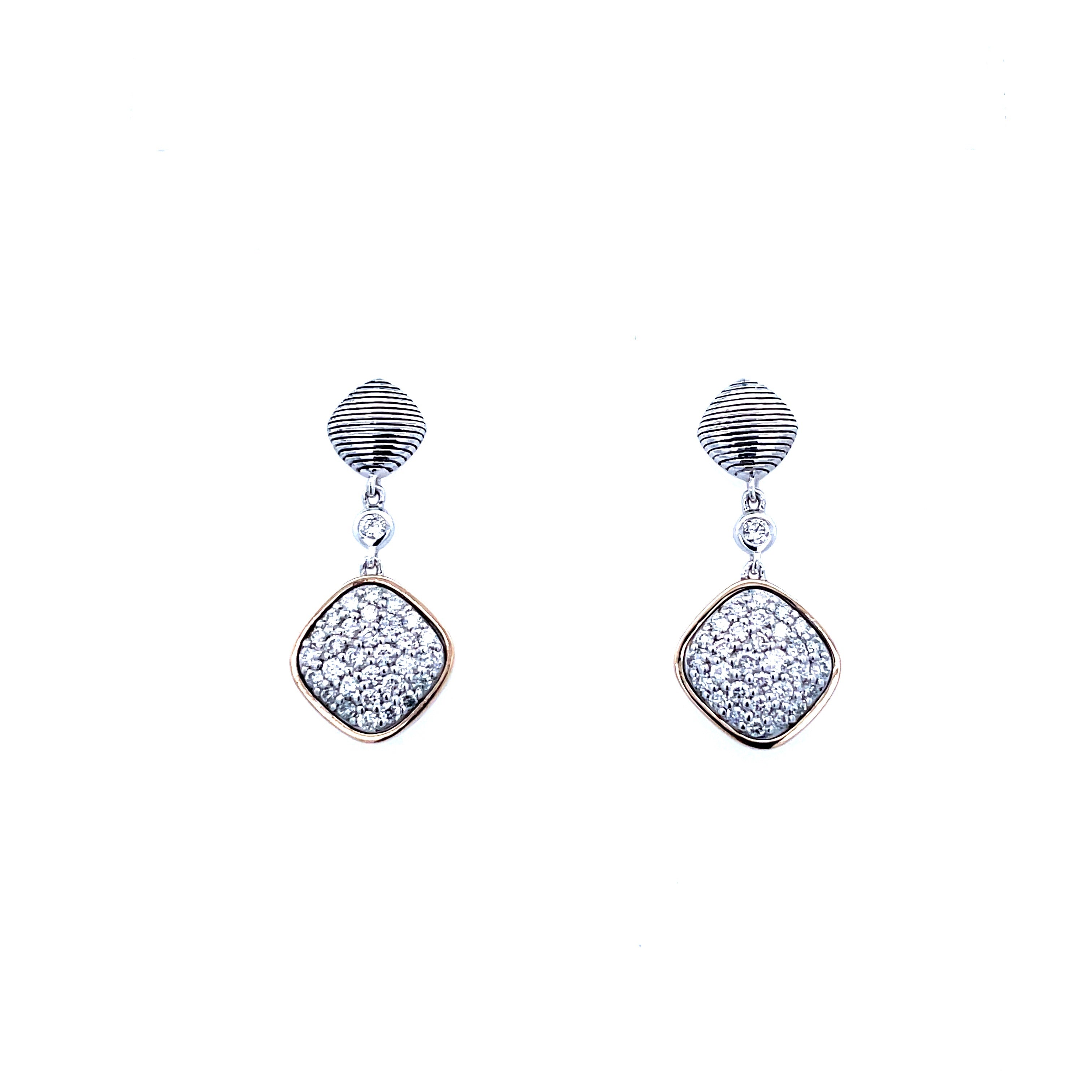 Lady's Tt 18K/Ss Dangle Pave' Earrings With 0.76Tw Round G/H Si1 Diamonds Regularly $2400 Vendor Price $1200

Purchases made from our Vendor Price case are not eligible for "complimentary" services. Standard ring sizings, setting fees, and yearly rhodiu