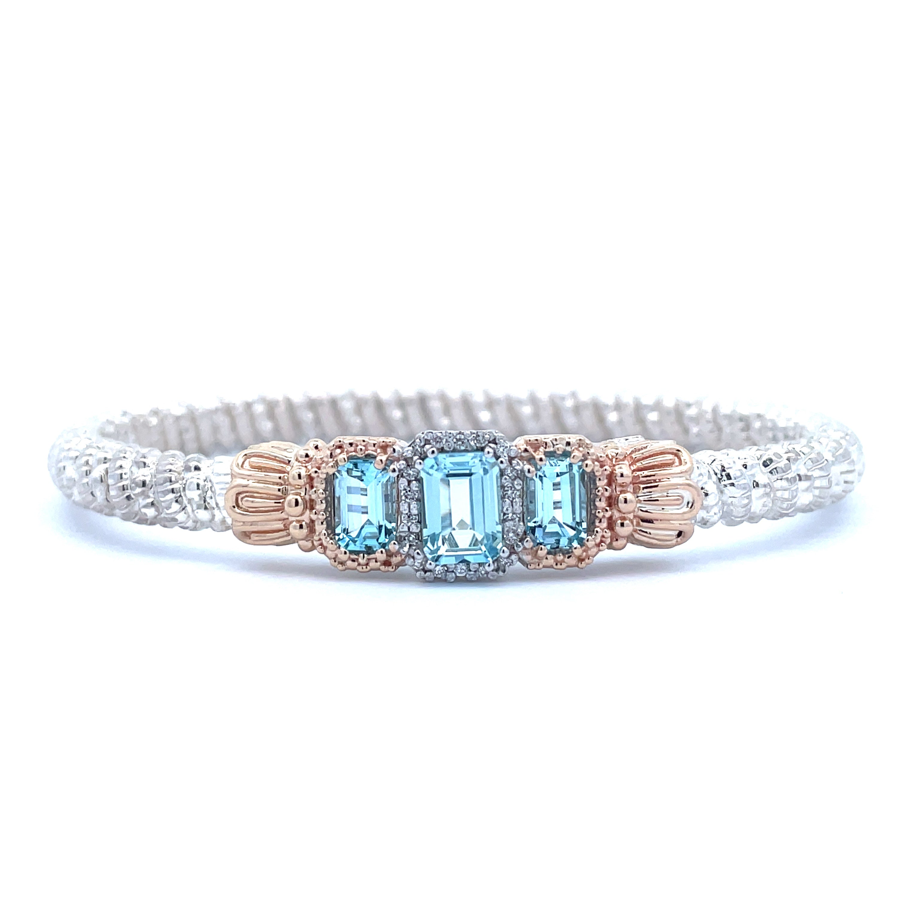 Lady's Yellow/White 14K/Ss Three Stone With Halo 4Mm Closed Band Bracelet With 3= Emerald Blue Topazs And 0.09Tw Round G/H Si1 Diamonds