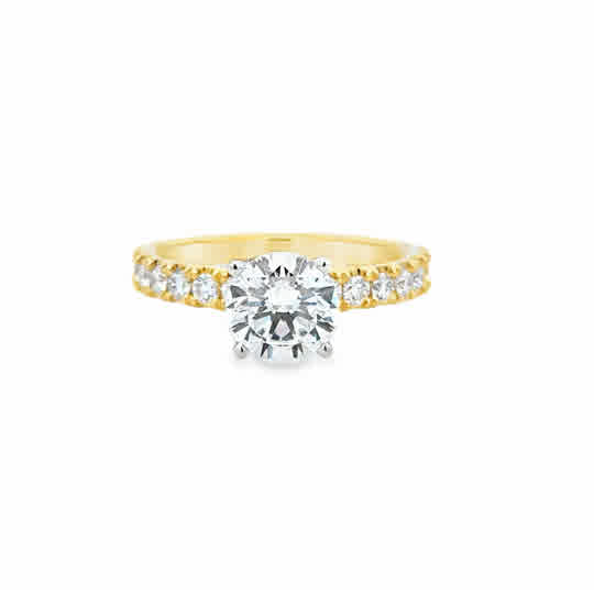 14 Karat Yellow Gold Engagement Ring with 7.5mm Round Cubic Zirconium, and  .50ctw Round Brilliant Cut Diamonds