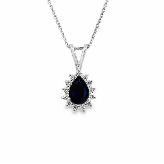 14 Karat White Gold Halo Pendant with 7x5mm, "A" Pear Cut Sapphire, with Round Brilliant Cut Diamonds