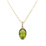 Lady's Yellow 14 Karat Partial Halo, With Oval Link Chain Necklace Length 18 one = 3.13ct Oval Peridot
13 = 0.06tw Round G/H SI1 Diamonds