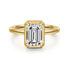 Lady's Yellow 14 Karat Bezel Set Solitaire Ring one = Emerald Cubic Zi