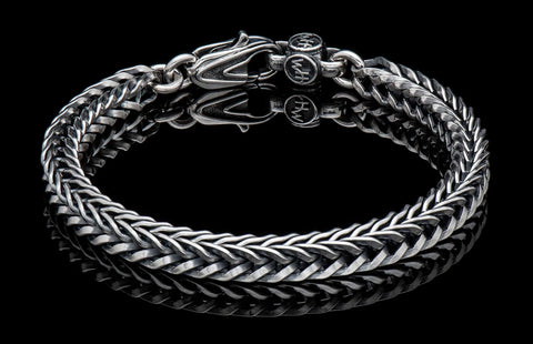 Bold, supple, fluid, snakelike, this foxtail chain bracelet  in sterling silver is in a league of its own. Beautifully oxidized and hand polished, this complex pattern flows around the wrist and draws the eye closer. There are a great many foxtail pattern