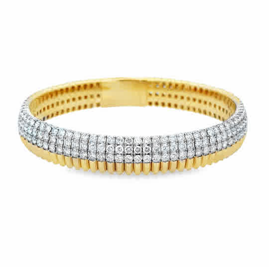 14 Karat Yellow Gold Flexie Bangle with 8ctw H/I Si1-Si2 Round Diamonds. Size 6.75''