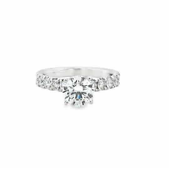 14 Karat White Gold Engagement Ring with 7.5mm Round Cubic Zirconium, and .75ctw Round Brilliant Cut Diamonds
