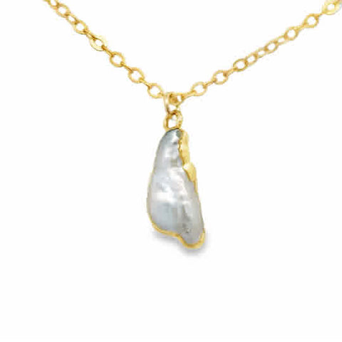 An irregular pearl with gold-plated silver around the edges hung on an 18″ gold-filled dainty chain.