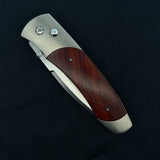 William Henry Knife Titanium Pocketknife With Stainless Blade And Cocobolo Wood, The A300-7 Features A Frame In Hand-Finished Aerospace Grade Titanium, Inlaid With Cocobolo Wood. The Blade Is Crafted From S35vn, A Rugged Stainless Steel Honed To A Razor’S