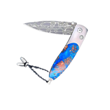 The Monarch ‘Blue Grove' William Henry Knife with Aerospace Grade Titanium with Mini Pine Cones Set in Resin and 'Intrepid' Damascus Steel Blade.